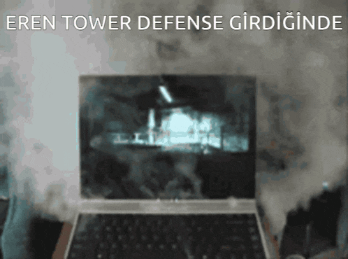 a laptop with the words eren tower defense on the top