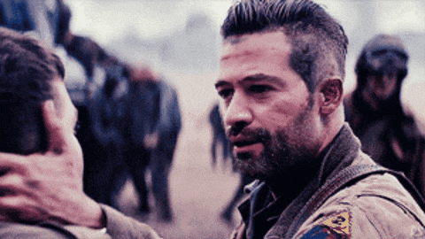 a man with a badge on his chest that says ' army '