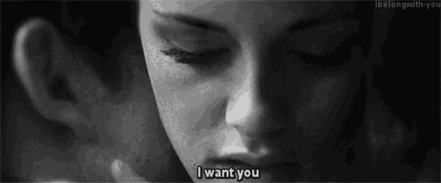 a close up of a woman 's face with the words " i want you " written on the bottom