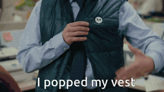 a man wearing a vest that says " i popped my vest "