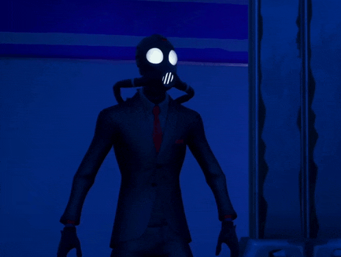 a man in a suit and tie has a gas mask on his face