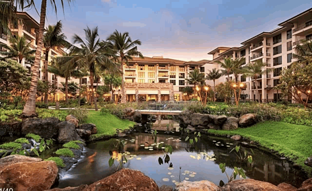 a large building with a pond in front of it that says 1/60