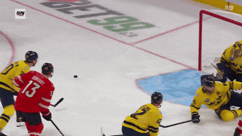 a hockey player with the number 13 on his back