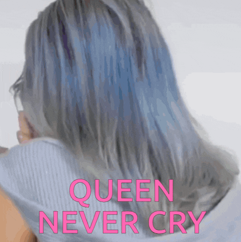 a woman with blue hair has the words queen never cry above her head