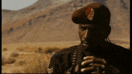 a man in a military uniform has a badge on his hat that says ' u.s. army ' on it