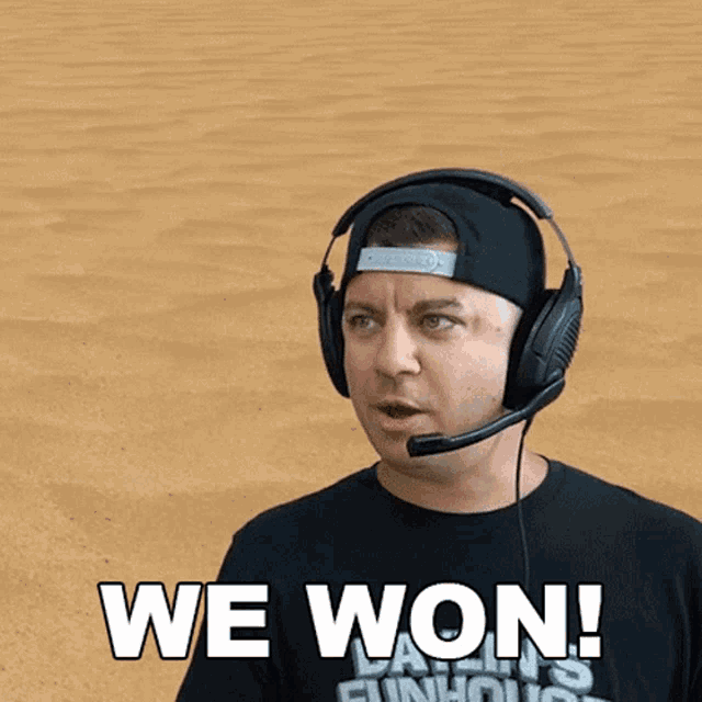 a man wearing headphones says " we won "