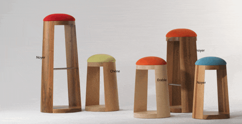 a row of wooden stools with the word noyer written on the bottom