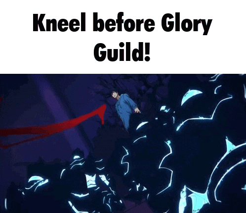 a man in a blue shirt is kneeling down in front of a giant monster .