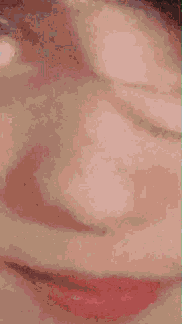 a purple and pink background with a few spots of orange