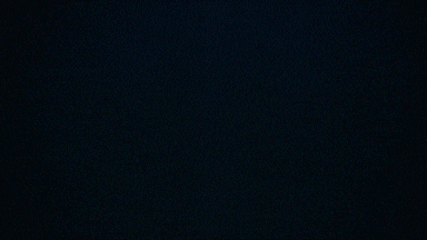 a blue flame is coming out of a candle holder in a dark room