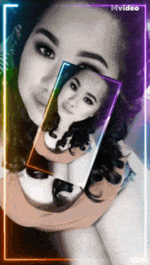 a woman is taking a picture of herself with a rainbow colored frame behind her
