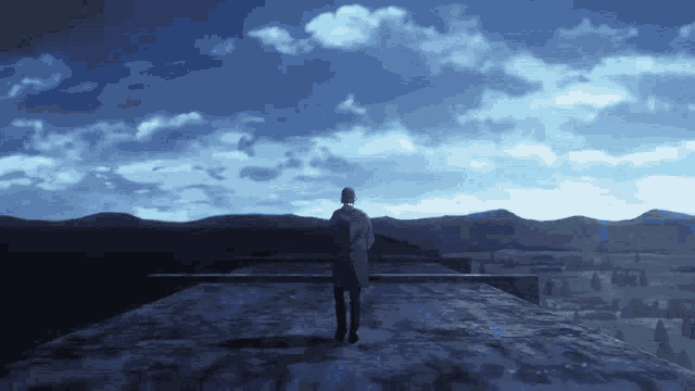 a man in a white coat stands on a rooftop looking out over mountains