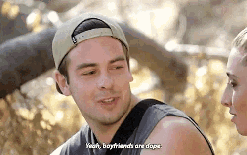 a man in a baseball cap is talking to a woman and says yeah boyfriends are dope