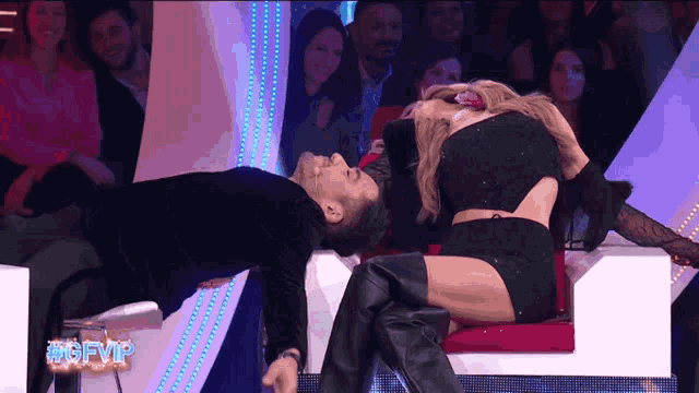 a man and a woman are dancing on a stage with the words #gfvip in the corner