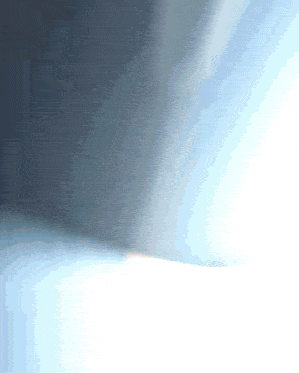 a light shines through a window in a room