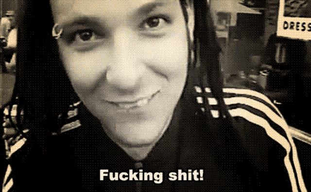 a black and white photo of a woman with dreadlocks and the words fucking shit on the bottom