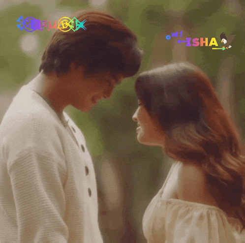 a man and a woman are looking at each other with a hashtag that says isha
