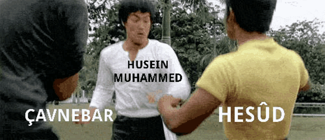 a man in a white shirt is standing next to a man in a yellow shirt and they are fighting each other .