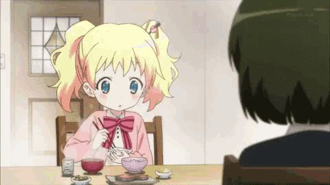 a little girl is sitting at a table with chopsticks and a bowl of food