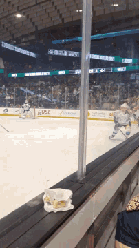 a hockey rink with a sign that says rose