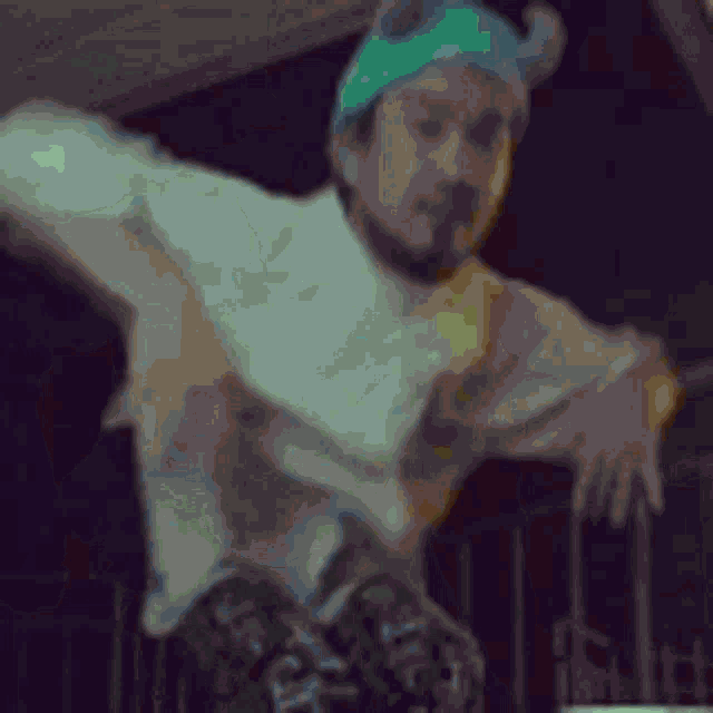 a man is wearing a viking hat and dancing on a balcony .