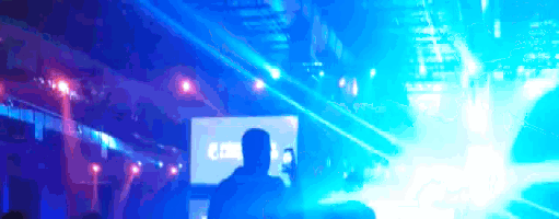 a man is standing in front of a screen that says ' a & a ' on it