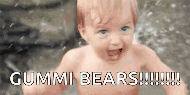 a baby without a shirt is standing in the water with the words gummi bears written on it .