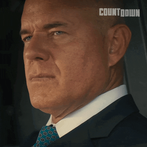a close up of a man 's face with the word countdown on the bottom right