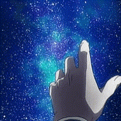 a person 's hand is pointing at a galaxy in the sky