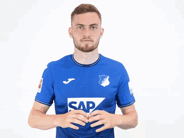 a man wearing a blue shirt that says sap on it