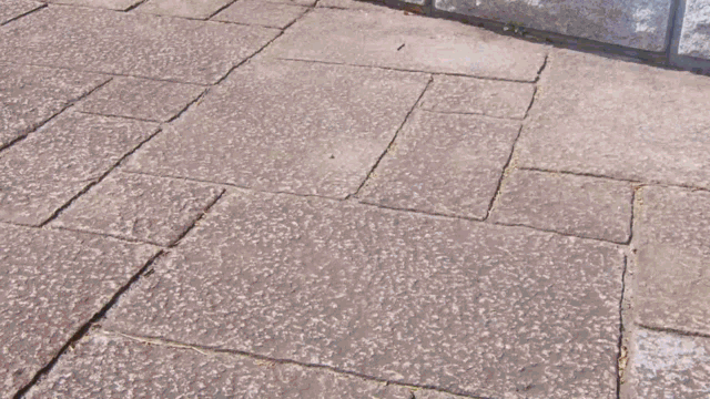 a person laying on the ground wearing a denim jacket