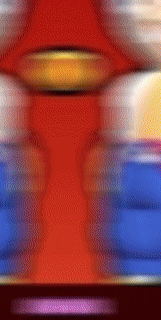 a blurred image of a red yellow and blue colored item