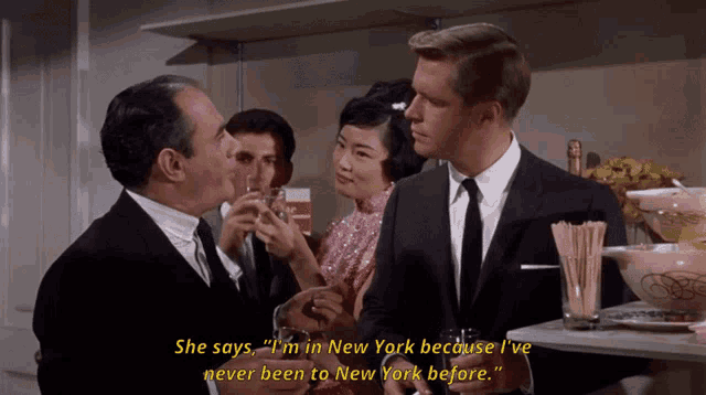 a man in a suit and tie says she says