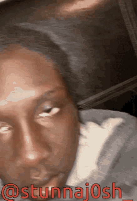 a close up of a person 's face with the words @stunnajosh_ on it