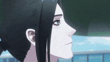 a close up of a person 's face with black hair