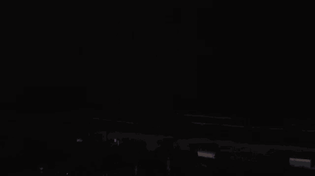 a balcony with a view of the ocean and a lightning bolt .