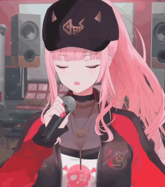 a girl with pink hair is singing into a microphone wearing a black hat that says bb