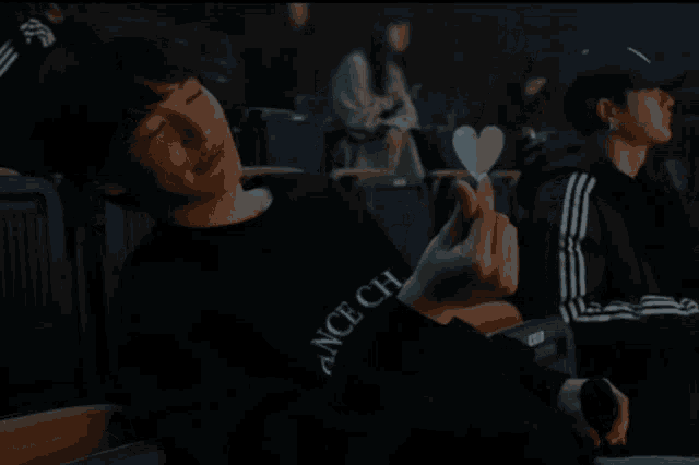 a man wearing a black shirt that says ce chance