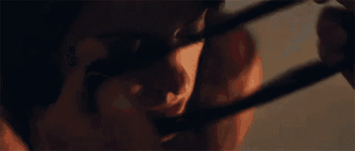 a close up of a person wearing a blindfold .