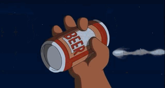 a hand is holding a can of beer with a splash of liquid coming out of it