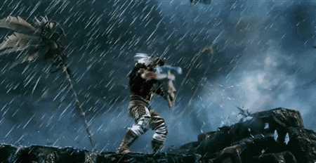a man standing in the rain with a sword in his hand
