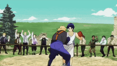 a group of people are watching a boxing match between two men