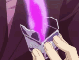 a person is holding a box that has a purple light coming out of it