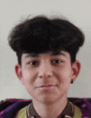 a close up of a young man 's face with a purple blanket on his back .