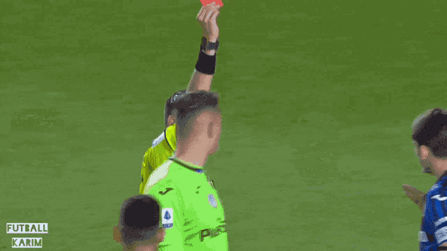 a man in a blue shirt with the number 2 on it