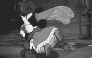 a black and white cartoon of mickey mouse and minnie mouse dancing