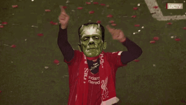 a man wearing a scarf that says ' lfc ' on it