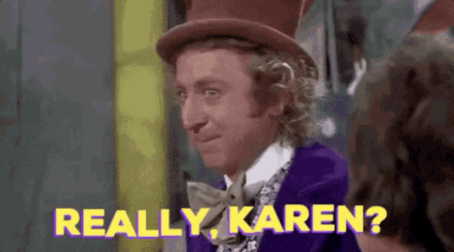 a man in a purple suit and top hat is talking to another man and says `` really karen '' .