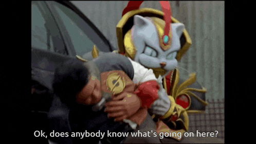 a man is being held by a cat with the words " ok does anybody know what 's going on here " below him