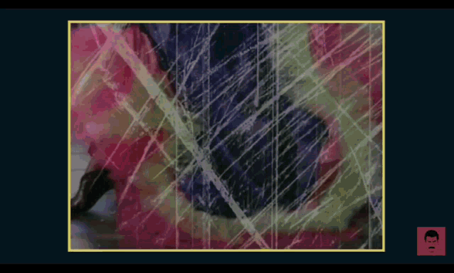 a screen shot of a video with a yellow border and a man 's head in the upper right corner
